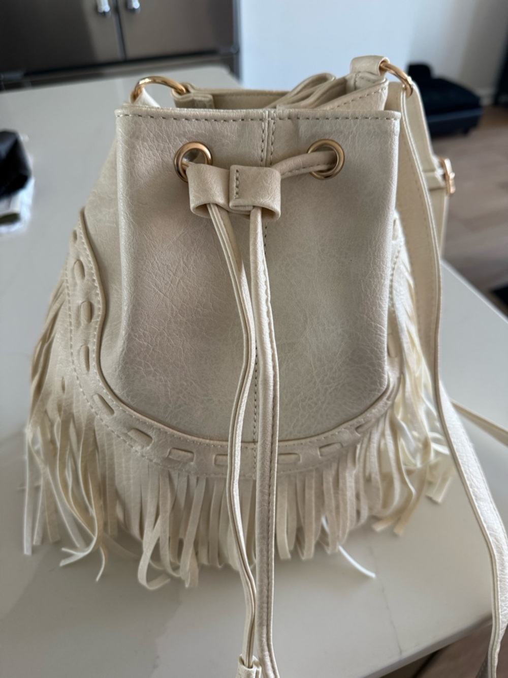 Vici Cream Fringe Drawstring Crossbody Bag